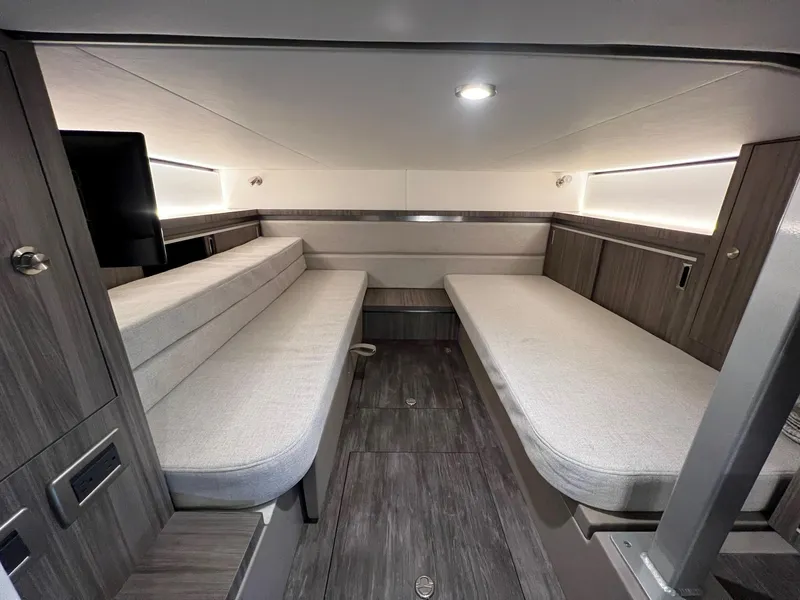 Slide: The Image of 2025 Sea Ray Sundancer 320 Coupe interior with modern seating and sleek design. - 20