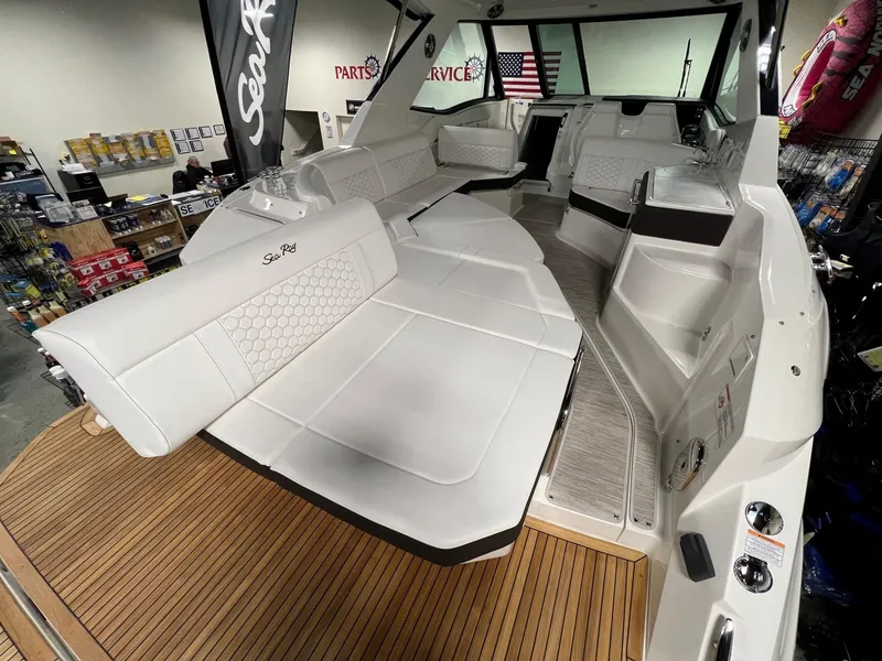 Slide: The Image of 2025 Sea Ray Sundancer 320 Coupe interior with luxurious seating and modern design. - 4