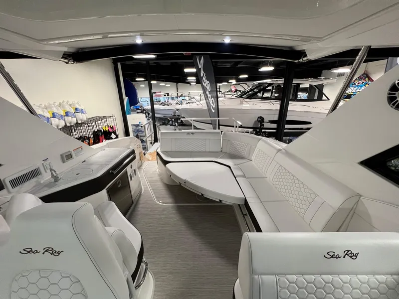 Slide: The Image of Luxurious interior of 2025 Sea Ray Sundancer 320 Coupe yacht, featuring elegant seating and modern amenities. - 6