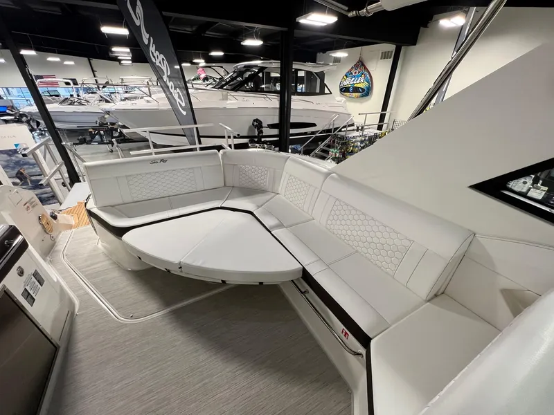 Slide: The Image of 2025 Sea Ray Sundancer 320 Coupe interior with spacious seating area. - 7