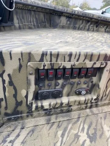 Slide: The Image of Control panel of SeaArk 1960 Slayer Pro 2025 with camouflage design. - 5
