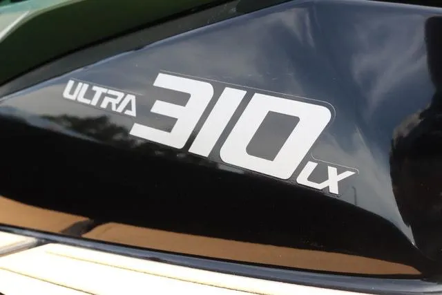Slide: The Image of 2025 Kawasaki Jet Ski Ultra 310 LX logo on sleek black surface. - 10