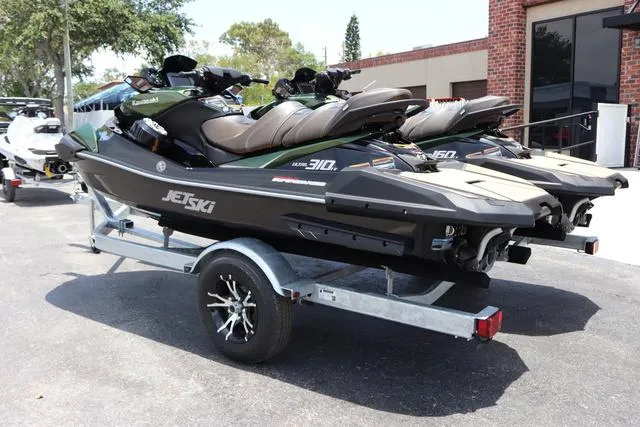 Slide: The Image of 2025 Kawasaki Jet Ski Ultra 310 on trailer, parked outdoors. - 4