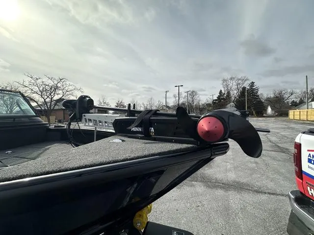 Slide: The Image of 2024 Lund 2175 Pro-V Sport boat cockpit with dual navigation screens and modern steering wheel. - 10