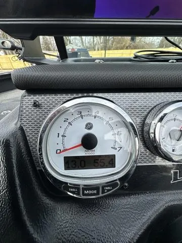 Slide: The Image of 2024 Lund 2175 Pro-V Sport dashboard with tachometer and digital display. - 16