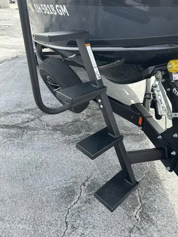 Slide: The Image of 2024 Lund 2175 Pro-V Sport boat interior with steering wheel and seat. - 8