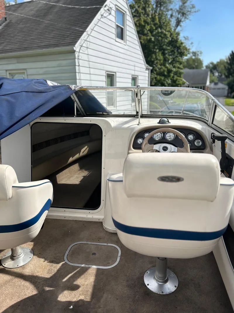 Slide: The Image of 2002 Chaparral 205SSE Cuddy boat interior with steering wheel and seating. - 7