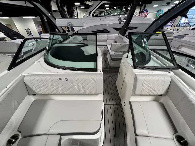 Slide: The Image of 2025 Sea Ray SDX 250 Surf boat interior with luxurious seating and sleek design. - 13