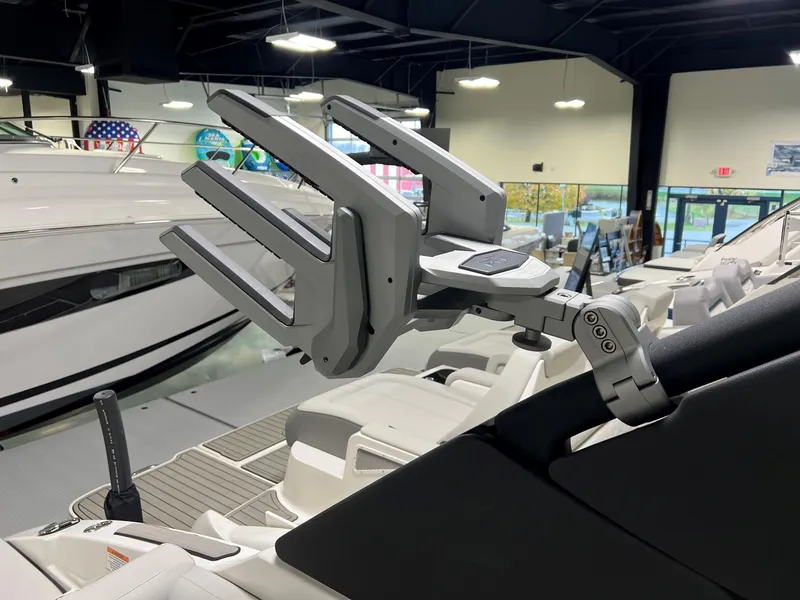 Slide: The Image of 2025 Sea Ray SDX 250 Surf boat interior with advanced wakeboard rack. - 16