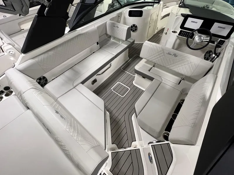 Slide: The Image of 2025 Sea Ray SDX 250 Surf boat interior with luxurious seating and modern dashboard. - 6