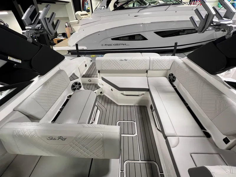 Slide: The Image of 2025 Sea Ray SDX 250 Surf boat interior with luxurious seating and modern design. - 7
