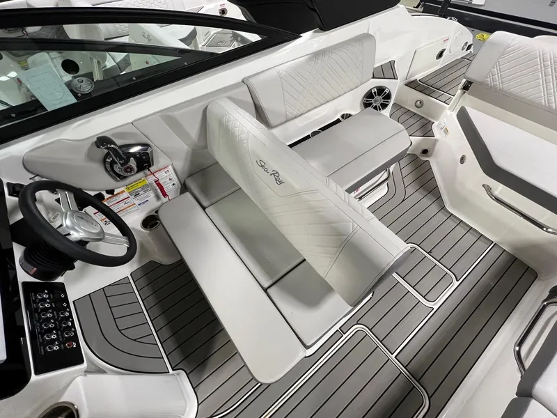 Slide: The Image of 2025 Sea Ray SDX 250 Surf boat interior with sleek seating and modern design. - 9