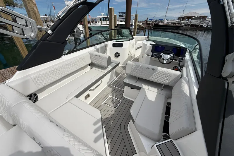 Slide: The Image of Luxurious 2025 Sea Ray SDX 250 Surf boat interior with elegant seating and modern dashboard. - 7