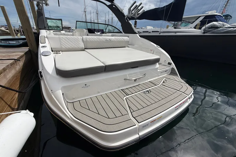 Slide: The Image of 2025 Sea Ray SDX 250 Surf boat with spacious rear seating and swim platform. - 3