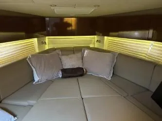 Slide: The Image of Luxurious interior cabin of 2013 Sea Ray 370 Venture with plush seating and ambient lighting. - 12