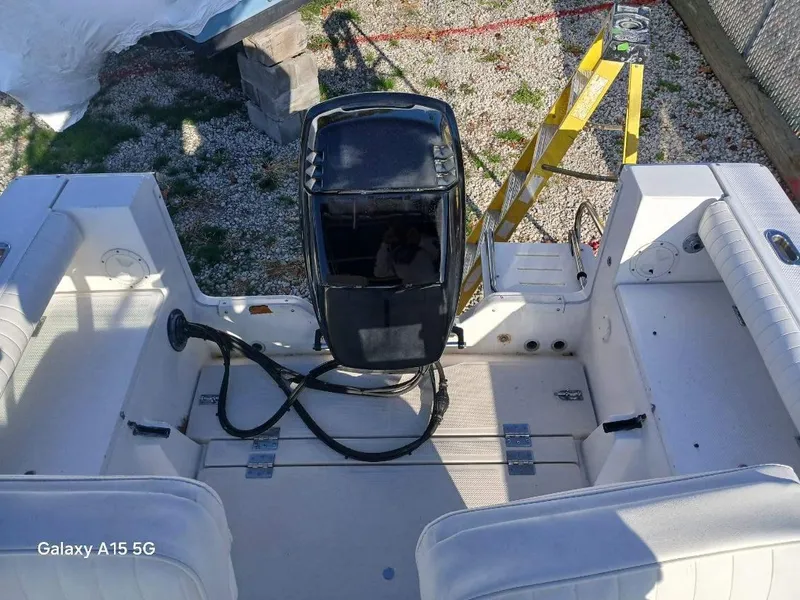 Slide: The Image of 1994 Robalo 23 boat with Merc Optimax 225 outboard engine, interior view. - 10
