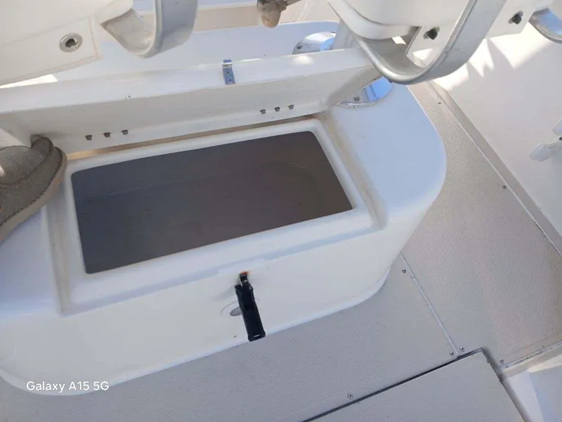 Slide: The Image of Open storage compartment on 1994 Robalo 23 boat deck. - 11