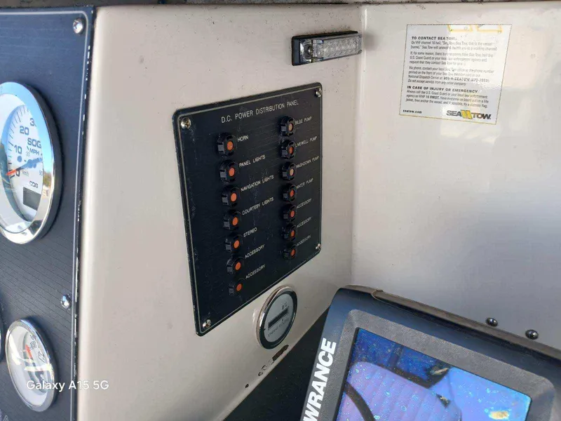 Slide: The Image of Control panel of a 1994 Robalo 23 with Merc Optimax outboard 225. - 15