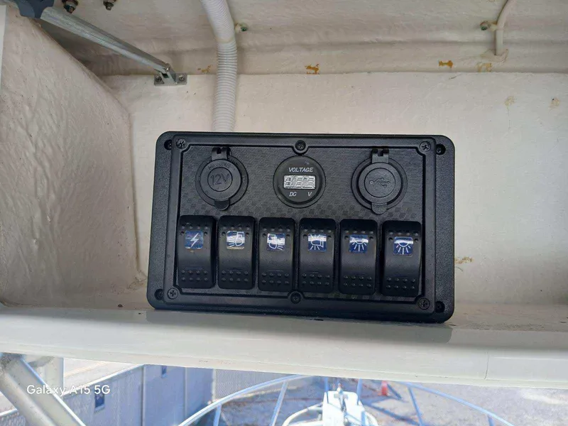 Slide: The Image of Control panel on a 1994 Robalo 23 with Merc Optimax outboard 225. - 17