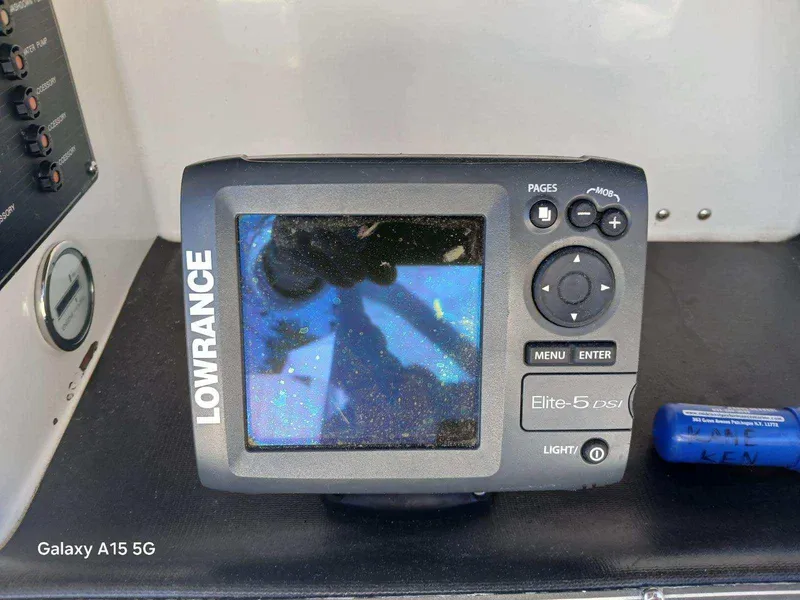 Slide: The Image of Lowrance Elite-5 GPS fishfinder on 1994 Robalo 23 boat dashboard. - 18