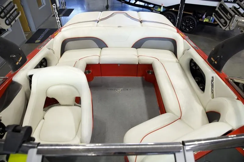 Slide: The Image of 2008 Centurion Enzo SV230 boat interior with white and red seating. - 17