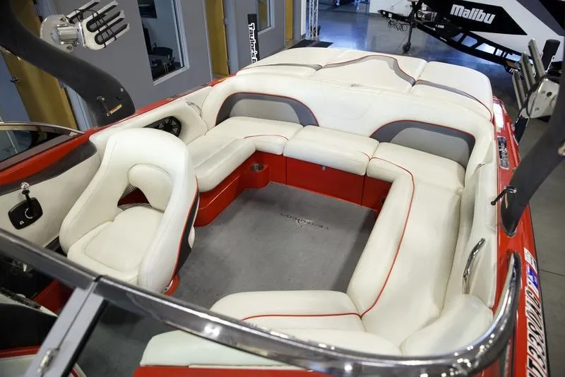 Slide: The Image of 2008 Centurion Enzo SV230 boat interior with white and red seating. - 18