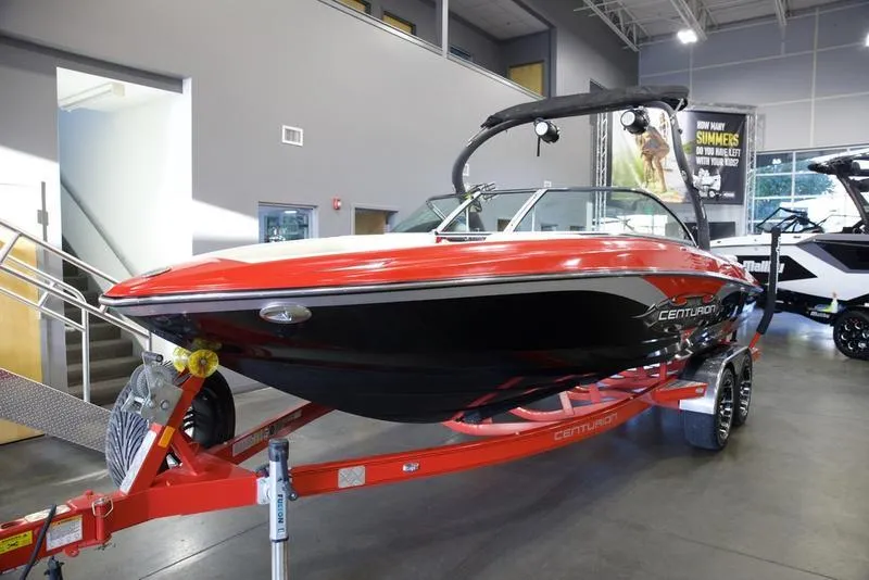 Slide: The Image of 2008 Centurion Enzo SV230 boat on red trailer in showroom. - 5