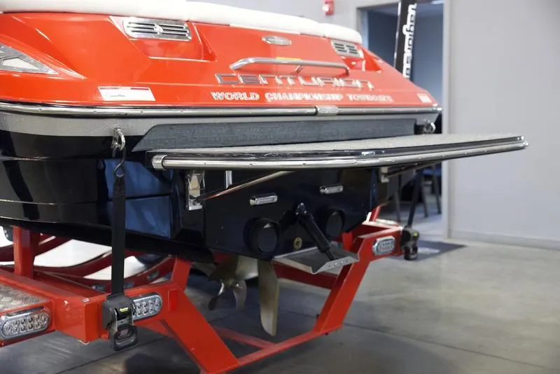 Slide: The Image of 2008 Centurion Enzo SV230 boat on trailer, rear view in garage setting. - 6