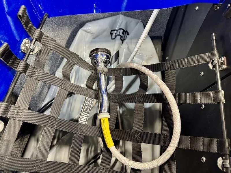 Slide: The Image of Axis T250 2022 boat interior with hose and safety netting. - 22