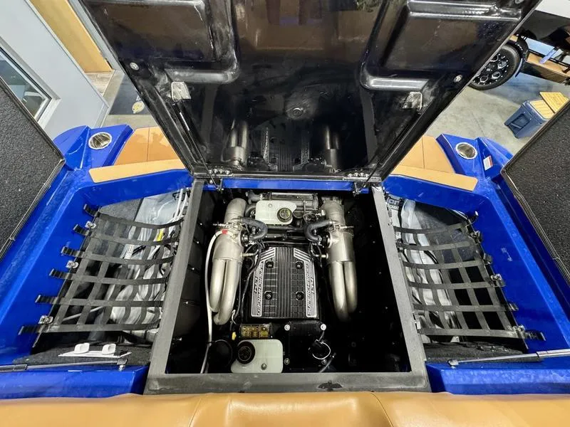 Slide: The Image of 2022 Axis T250 engine compartment with open hatch, showcasing powerful motor and components. - 23