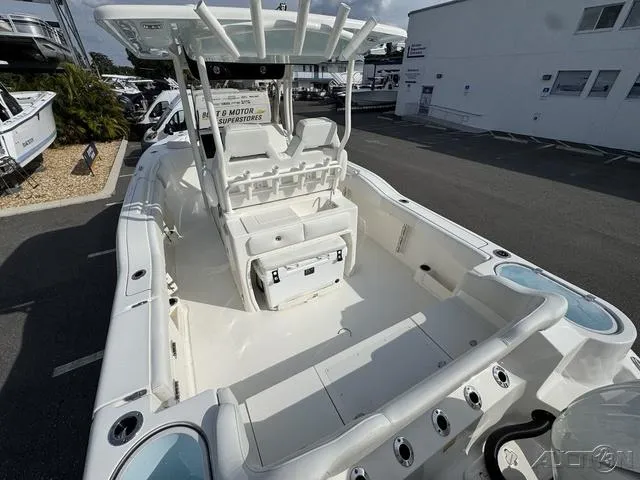 Slide: The Image of 2025 Key West 263 FS boat interior with seating and storage compartments. - 13