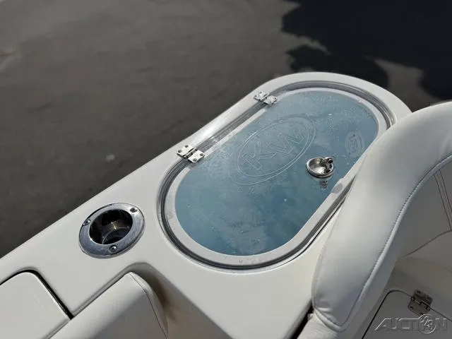 Slide: The Image of 2025 Key West 263 FS boat livewell with open lid, showcasing interior design. - 19