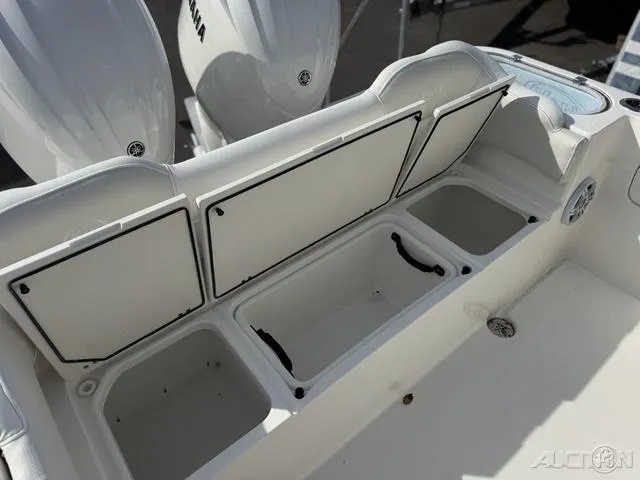 Slide: The Image of 2025 Key West 263 FS boat interior with seating and storage compartments. - 21