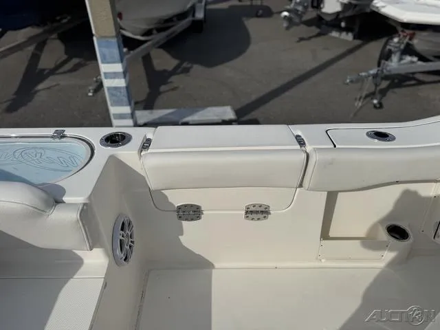 Slide: The Image of 2025 Key West 263 FS boat interior with seating and speaker detail. - 23