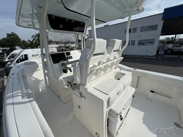 Slide: The Image of 2025 Key West 263 FS boat interior with seating and storage compartments. - 25
