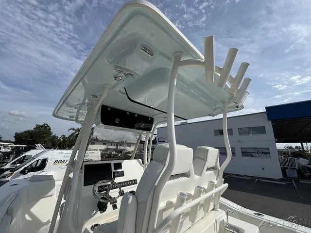 Slide: The Image of 2025 Key West 263 FS boat cockpit with modern controls and seating. - 27