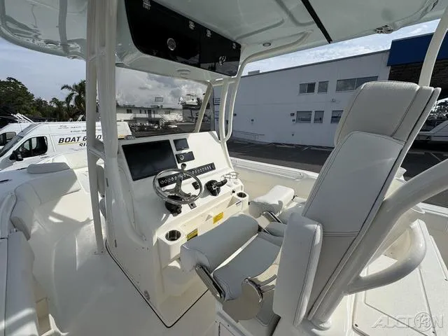 Slide: The Image of 2025 Key West 263 FS boat console with steering wheel and controls. - 28