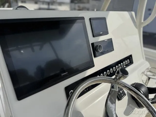 Slide: The Image of 2025 Key West 263 FS boat storage compartment with secure latches. - 30