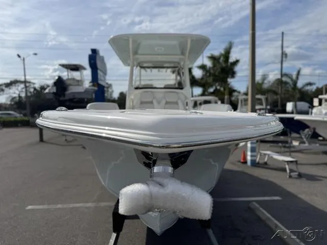 Slide: The Image of 2025 Key West 263 FS boat on trailer under sunny sky. - 4