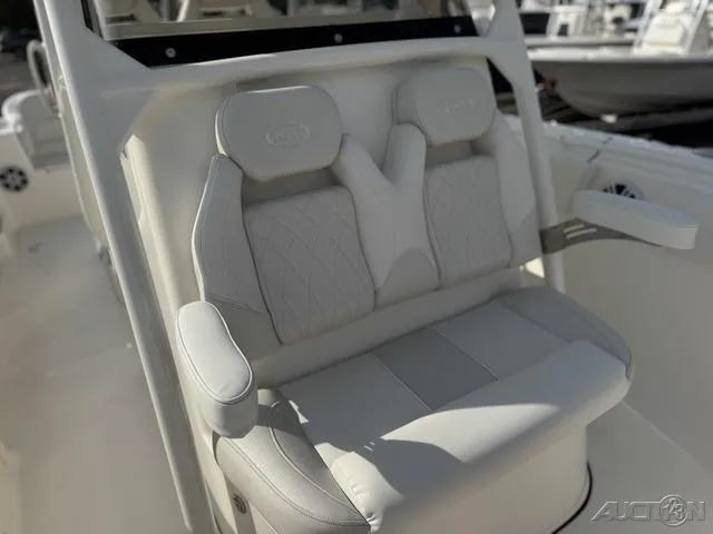 Slide: The Image of 2025 Key West 263 FS boat interior with white cushioned seating. - 44