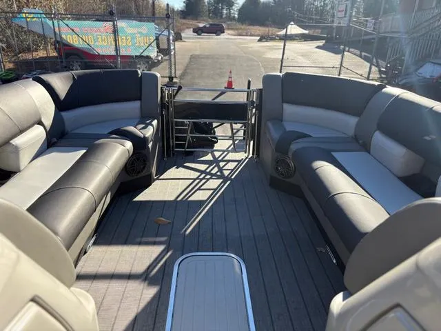 Slide: The Image of 2022 Starcraft MX 25 Q DC Tritoon interior with spacious seating and modern design. - 6