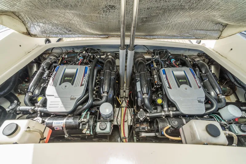 Slide: The Image of Engine compartment of 2012 Chris-Craft Corsair 28, featuring dual powerful engines. - 35