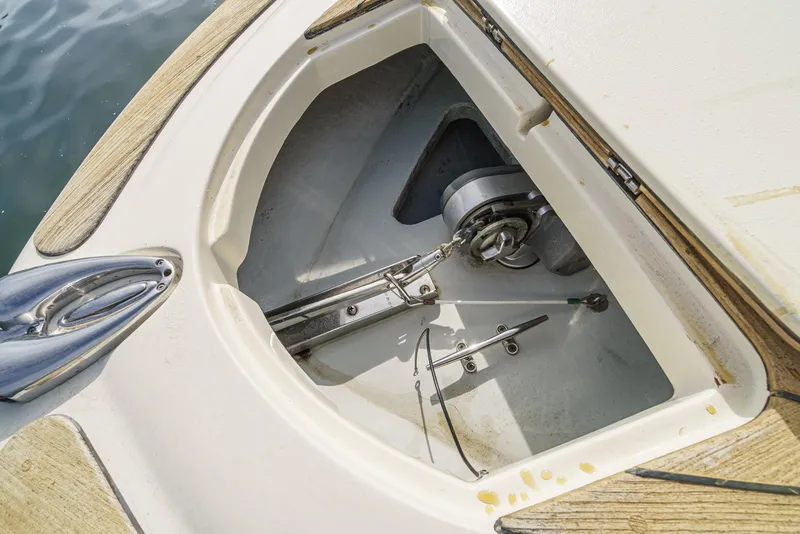 Slide: The Image of 2012 Chris-Craft Corsair 28 anchor compartment with stainless steel fittings and teak accents. - 9