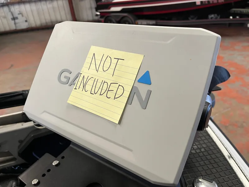 Slide: The Image of Triton 21 HP 2013 boat part with "Not Included" note on Garmin device. - 2