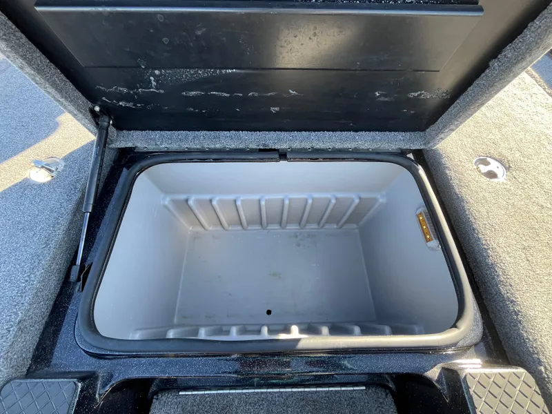 Slide: The Image of Open storage compartment in 2013 Triton 21 HP boat. - 34