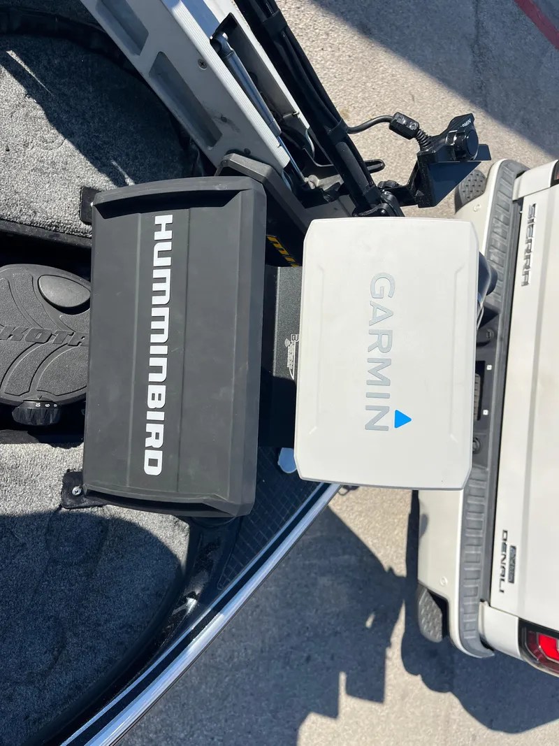 Slide: The Image of Humminbird and Garmin devices on 2013 Triton 21 HP boat. - 62