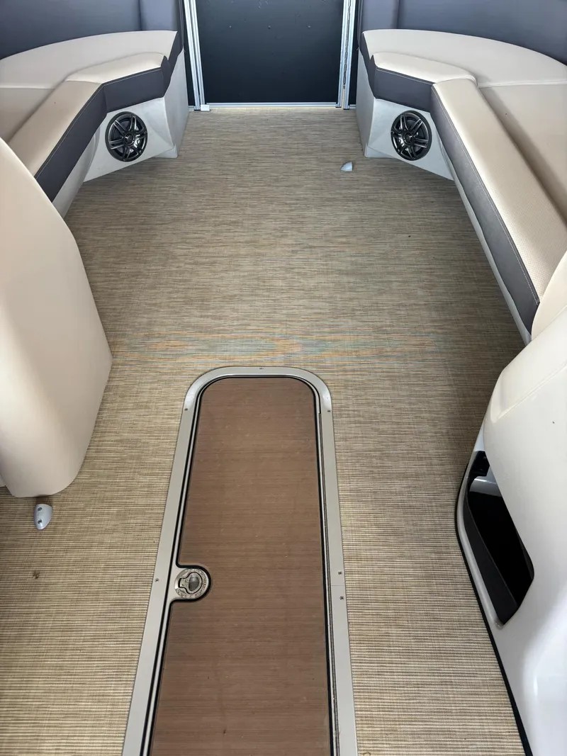Slide: The Image of 2025 Harris CRUISER 230 SLDH interior with beige seating and flooring. - 7