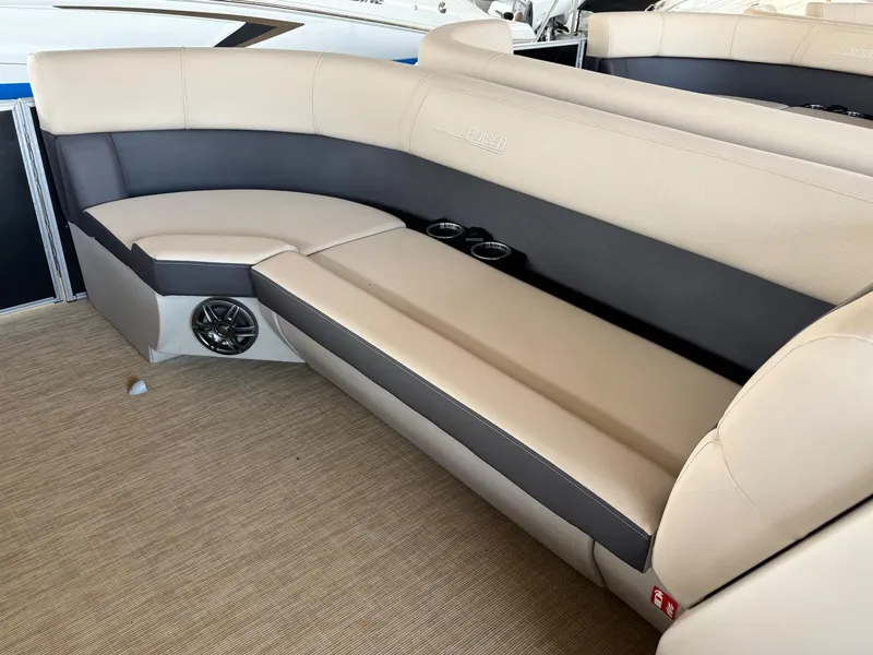 Slide: The Image of 2025 Harris CRUISER 230 SLDH boat interior with beige and black seating. - 9
