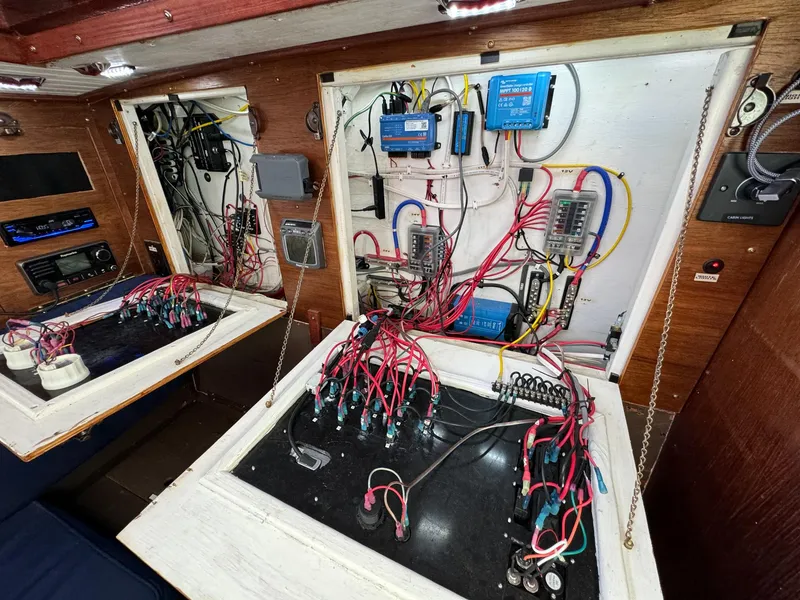 Slide: The Image of Electrical panel of a 1983 Islander Freeport sailboat with wiring and components. - 28