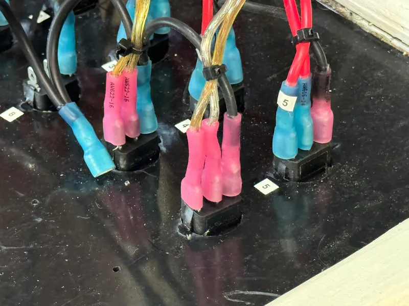 Slide: The Image of Colorful electrical wiring connections on 1983 Islander Freeport boat panel. - 29